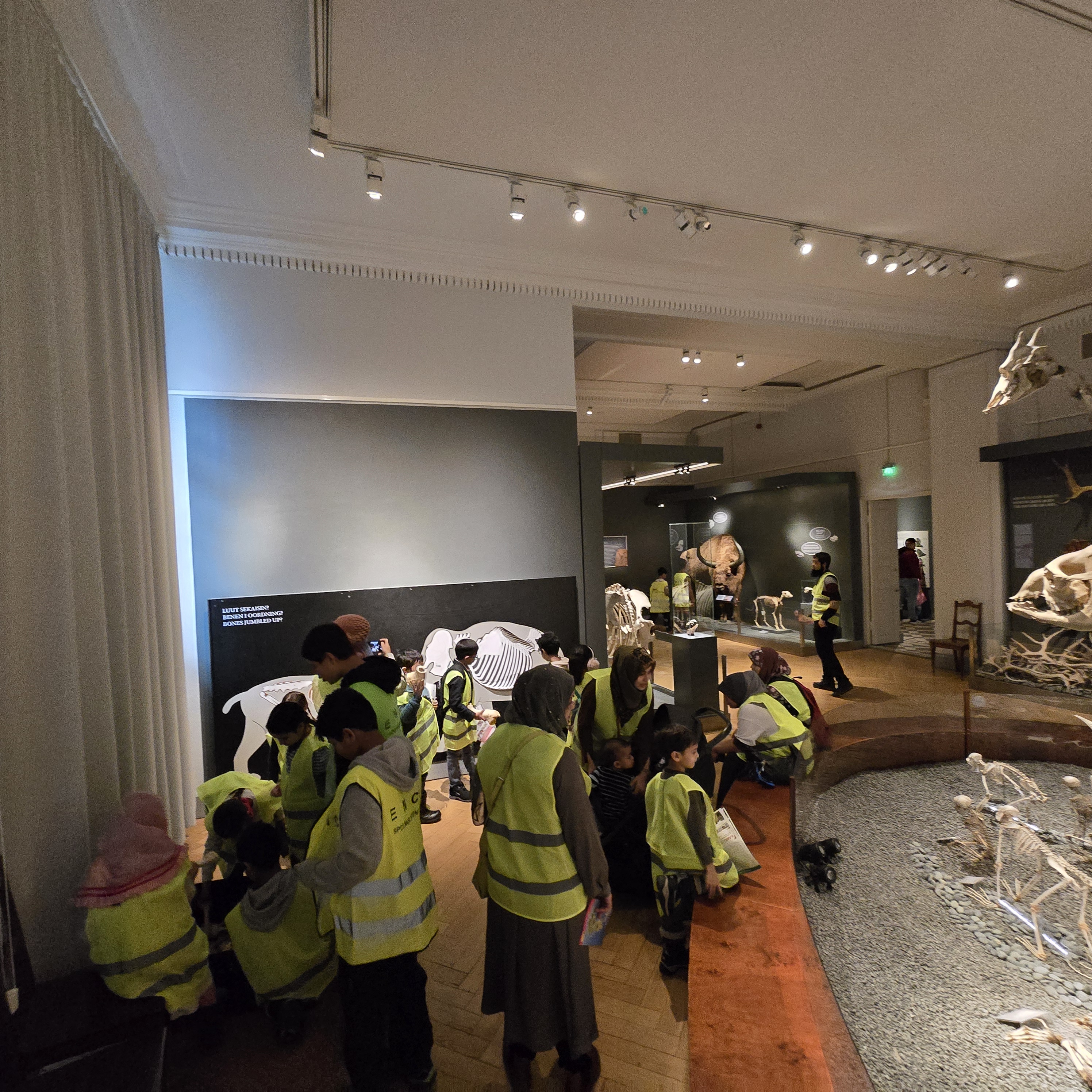 Children and volunteers on a museum trip as part of EMC's weekend-school program